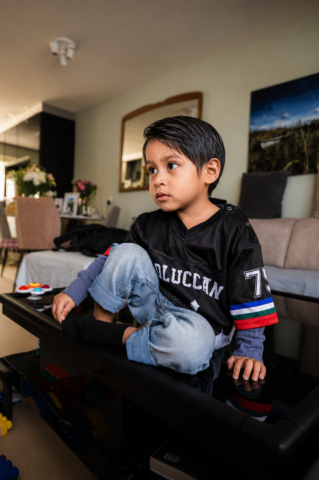 MATAGI Moluccan Kids Jersey Black — front view worn by child